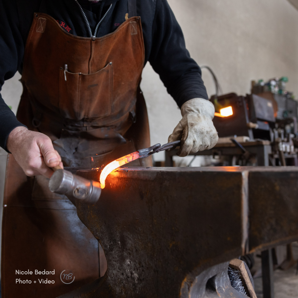 brand photography of blacksmith working in his workshop