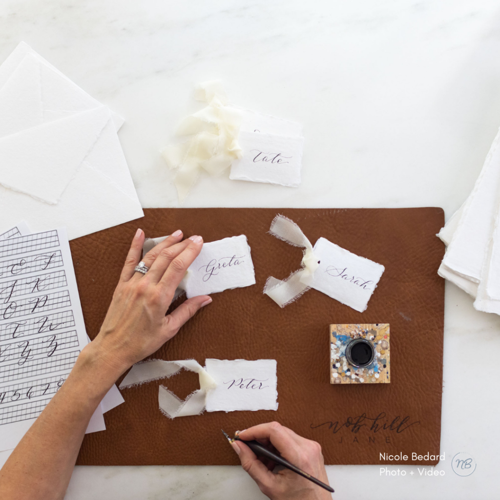 brand photography for calligrapher while they prepare and write custom place cards in their studio